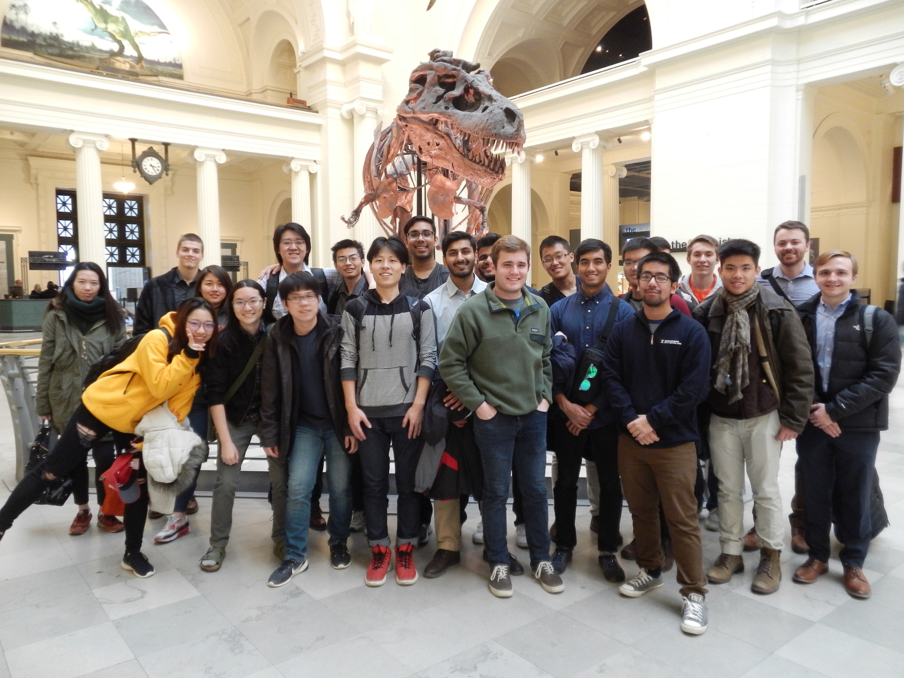 group of students with Sue the T-Rex