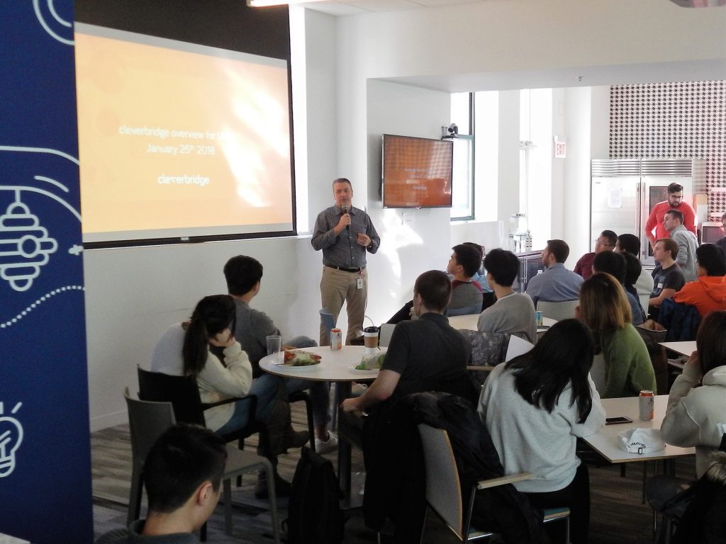 Cleverbridge co-founder and Illini Engineer Craig Vodnik welcomes the group to the Chicago office. 