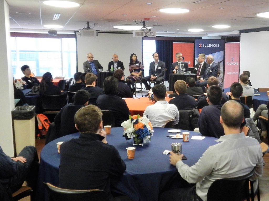 group of speakers and audience
