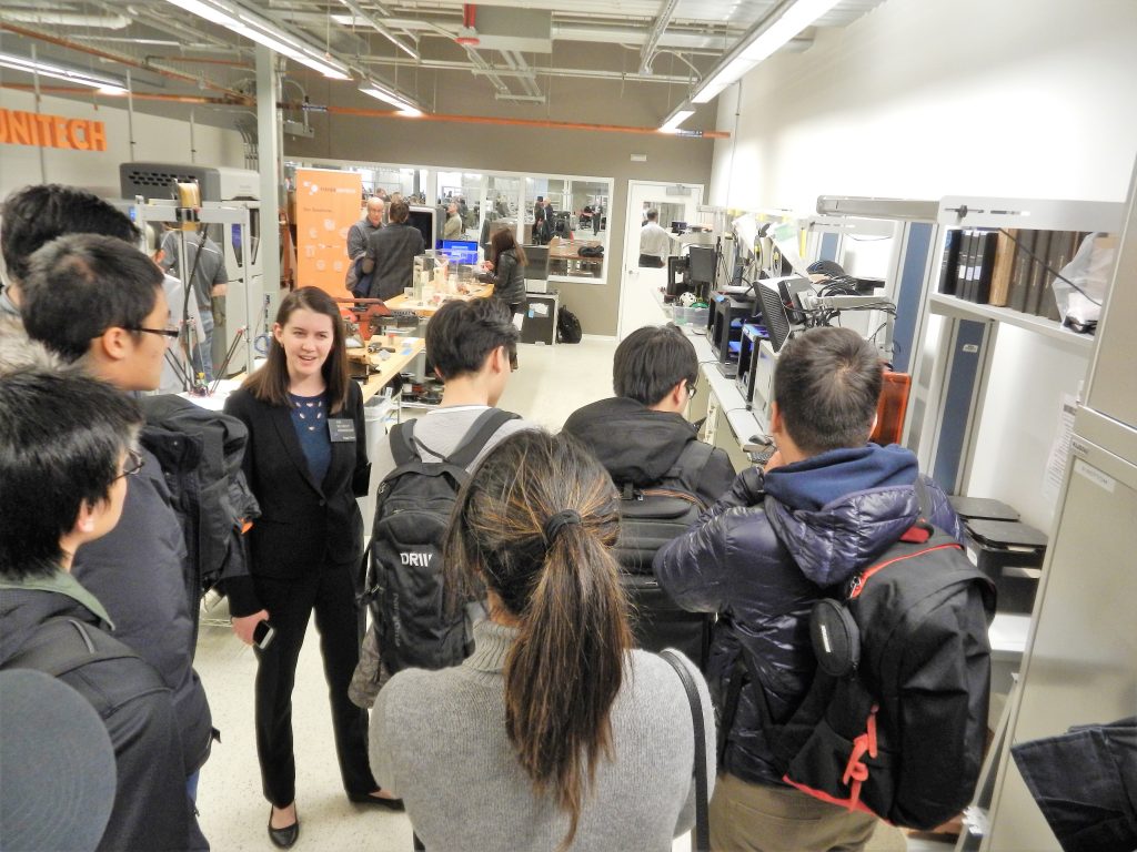 walking through lab of 3d printers