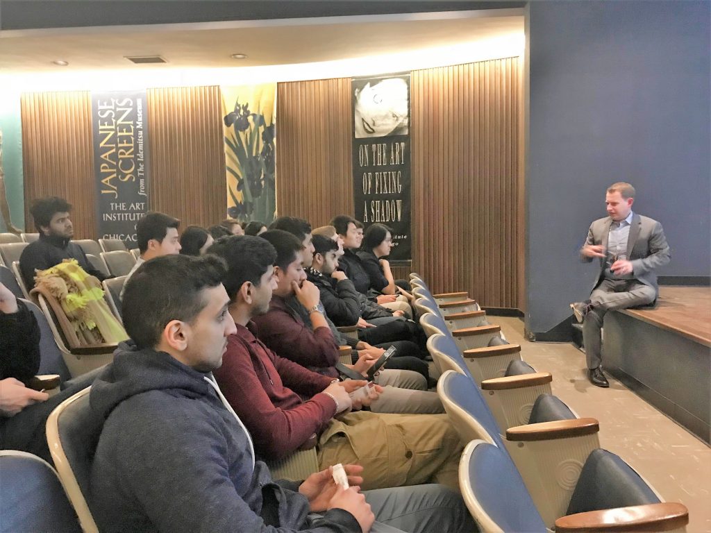 speaker talking to room of students
